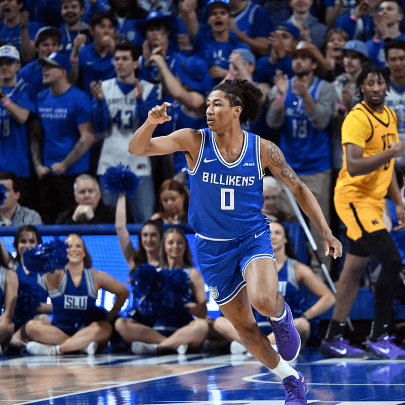 A basketball player wearing number zero runs up a basketball court.