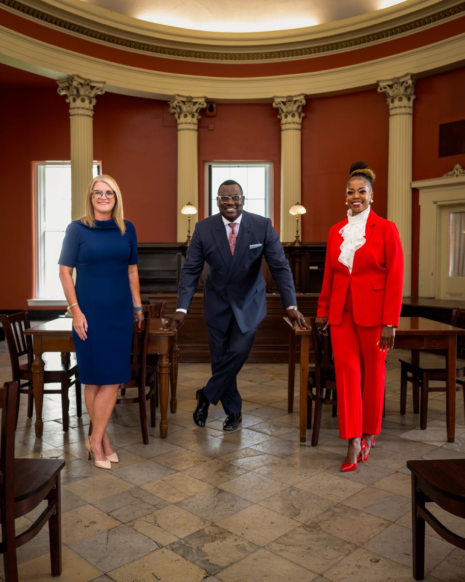 Jen Crompton, Untress Quinn, and Monique Abby pose in the Old Courthouse