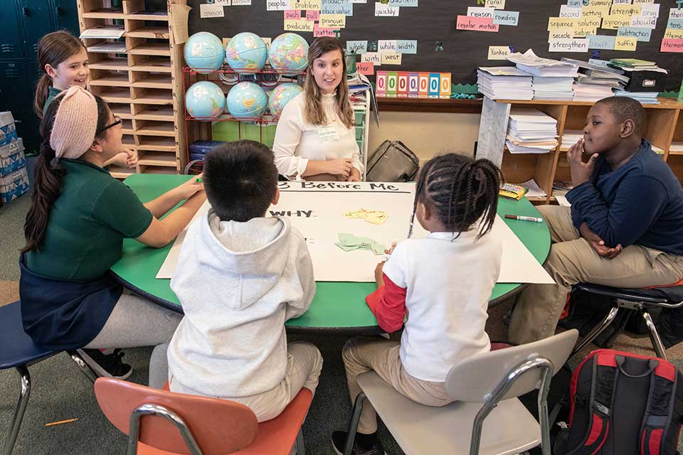 SLU student teaching younger students