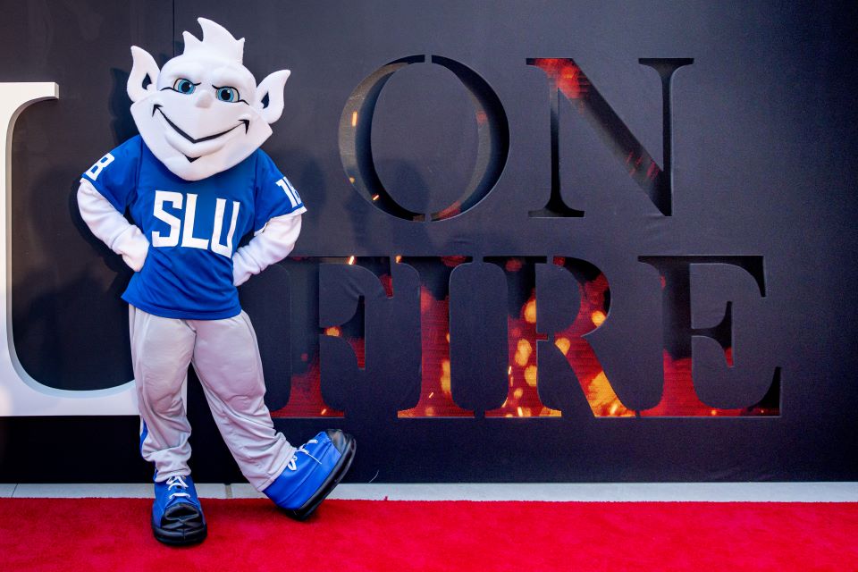 The Billiken poses on the red carpet.